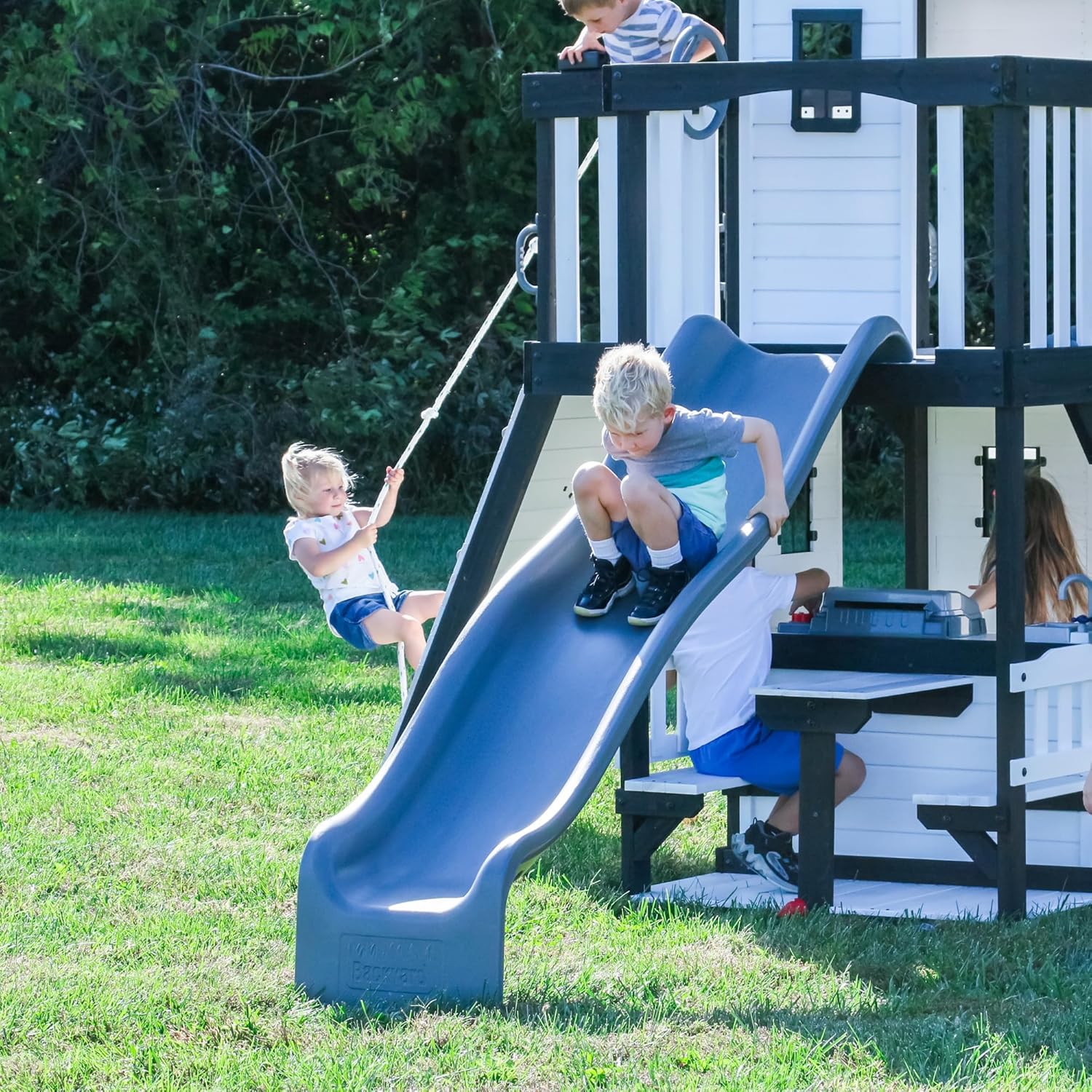 Backyard Discovery Canyon Creek Cedar Wood Swing Set with Wave Slide, Clubhouse, Play Kitchen, Picnic Area, Swings and Rock Wall